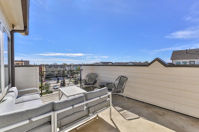 view of patio / terrace with a balcony and an outdoor living space