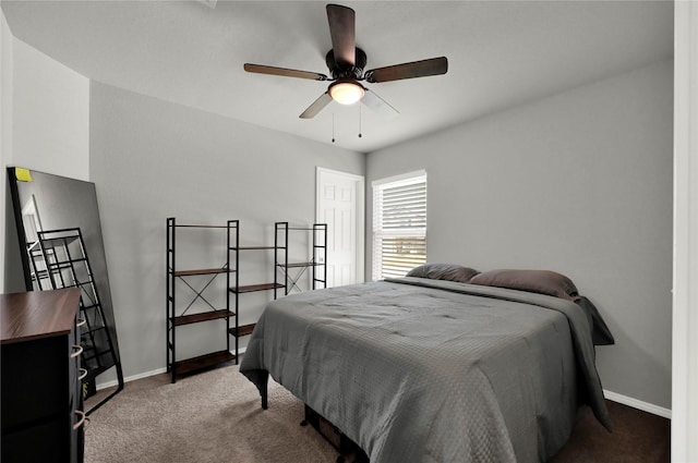 bedroom featuring ceiling fan, baseboards, and carpet flooring