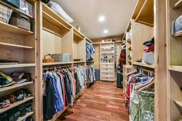 spacious closet with wood finished floors