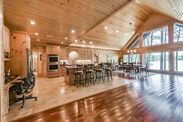 dining room featuring high vaulted ceiling, wooden ceiling, recessed lighting, visible vents, and light wood-style floors