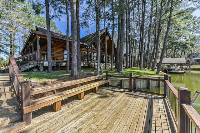 exterior space with a water view and a boat dock