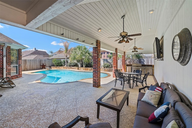 view of pool with a patio area, outdoor lounge area, ceiling fan, and a fenced backyard