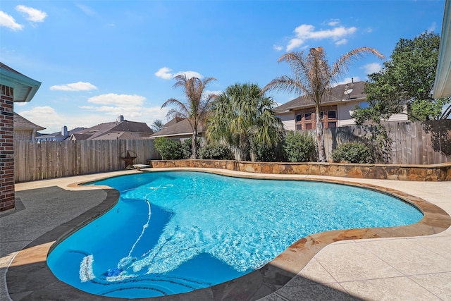 view of pool with a fenced in pool, a fenced backyard, and a patio