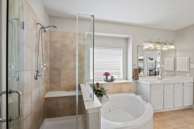 full bathroom with a whirlpool tub, a stall shower, vanity, and tile patterned floors