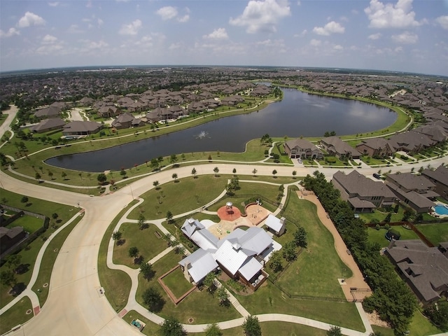 birds eye view of property featuring a water view and a residential view