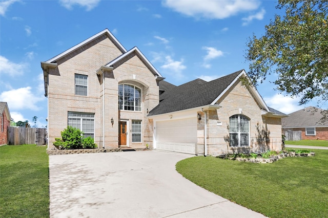 view of front facade featuring a garage, driveway, brick siding, and a front yard