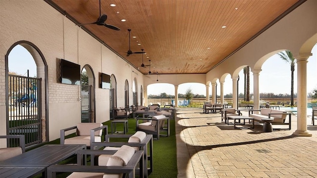 view of home's community featuring outdoor dining space and a patio area