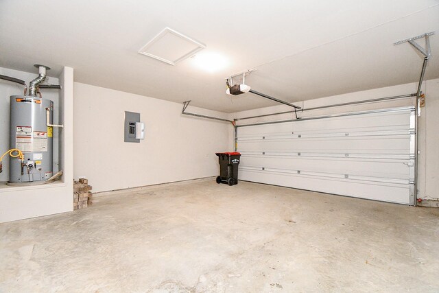 garage with a garage door opener, gas water heater, and electric panel