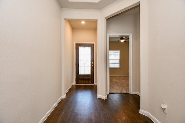 interior space featuring dark wood-style floors and baseboards