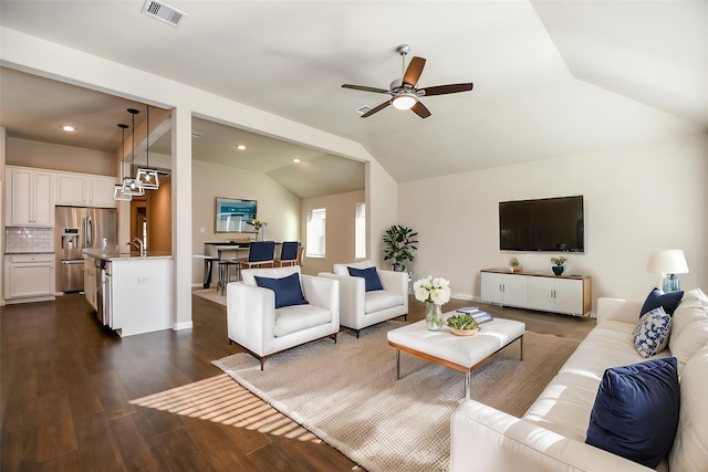 living area with dark wood-style floors, lofted ceiling, recessed lighting, visible vents, and ceiling fan