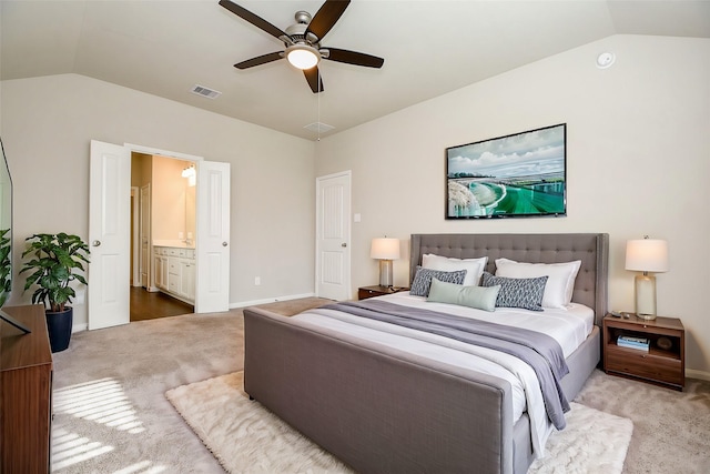 bedroom with lofted ceiling, baseboards, visible vents, and carpet flooring