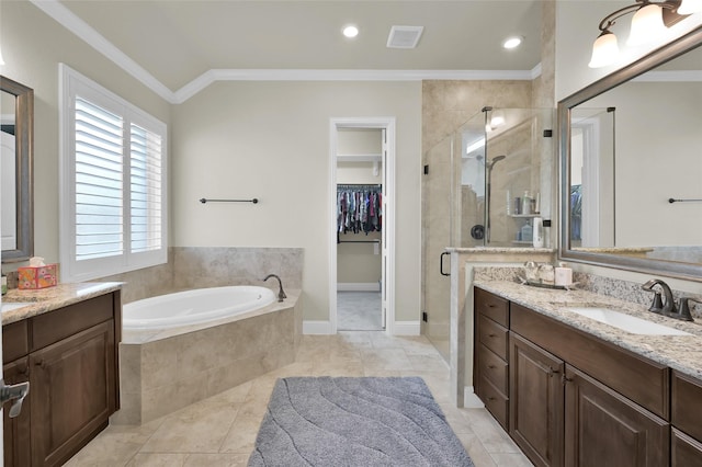 full bathroom with a spacious closet, a garden tub, ornamental molding, a stall shower, and vanity