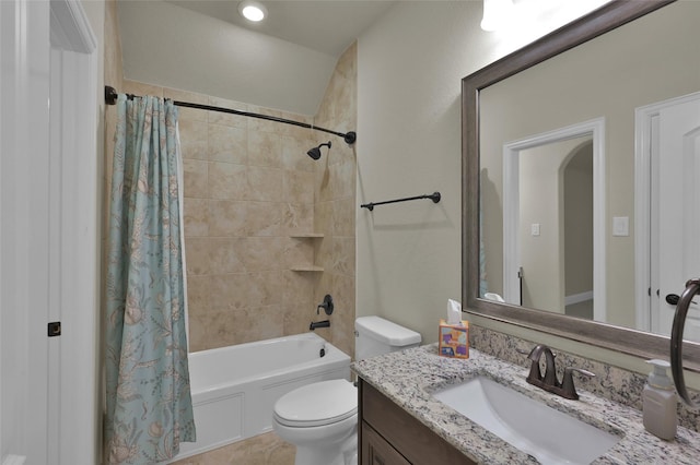 full bath featuring vanity, shower / bath combination with curtain, and toilet