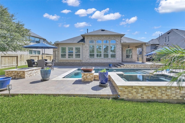 back of property featuring fence, a fenced in pool, brick siding, ceiling fan, and a patio area