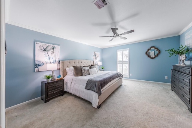 bedroom featuring ornamental molding, carpet, visible vents, and baseboards