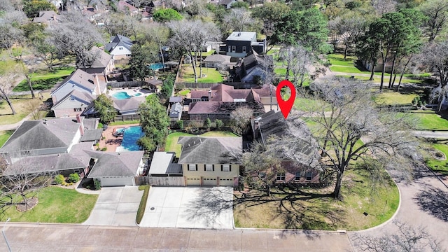 birds eye view of property with a residential view