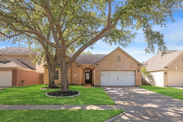 ranch-style home featuring an attached garage, brick siding, driveway, roof with shingles, and a front lawn