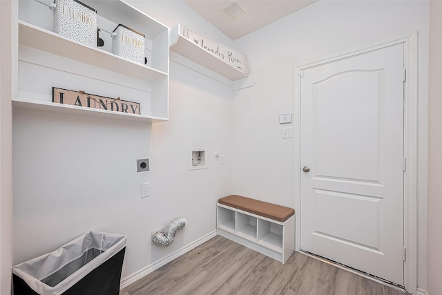 laundry room with laundry area, visible vents, light wood-type flooring, washer hookup, and electric dryer hookup