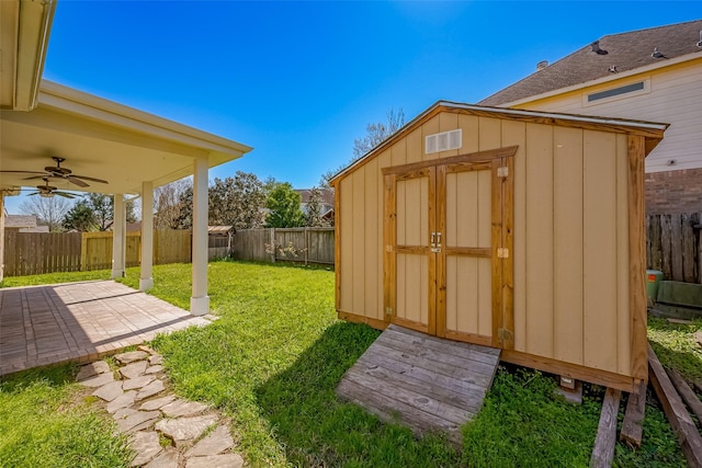 view of shed with a fenced backyard