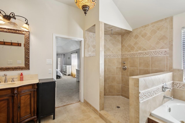 full bathroom with lofted ceiling, a garden tub, vanity, and walk in shower