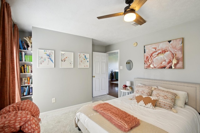 bedroom featuring visible vents, carpet flooring, a ceiling fan, and baseboards