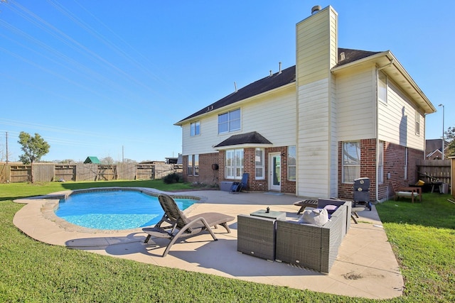 view of pool featuring a patio, a yard, a fenced backyard, and a fenced in pool