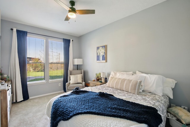 bedroom with a ceiling fan, carpet, and baseboards