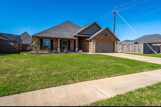 view of front of house featuring an attached garage, brick siding, fence, concrete driveway, and a front lawn