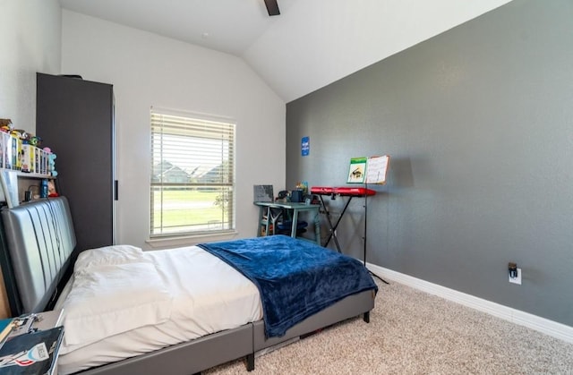 bedroom with carpet floors, ceiling fan, baseboards, and vaulted ceiling