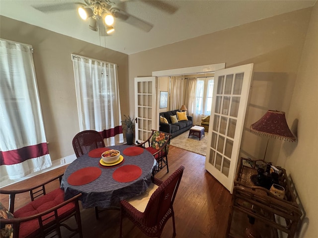 dining room featuring ceiling fan, french doors, and hardwood / wood-style floors