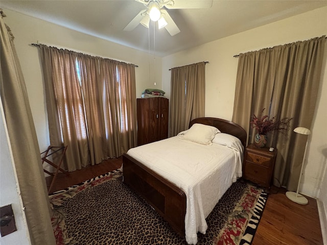 bedroom with wood finished floors and a ceiling fan