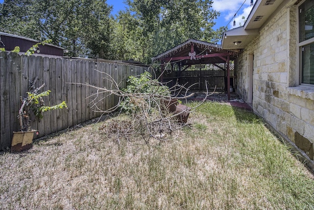 view of yard with a fenced backyard