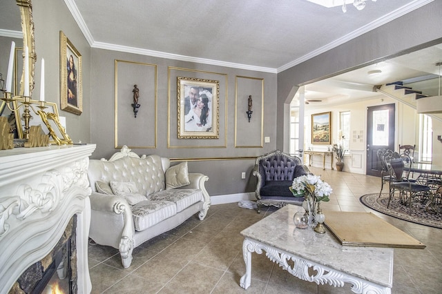 living room with arched walkways, crown molding, baseboards, and tile patterned floors