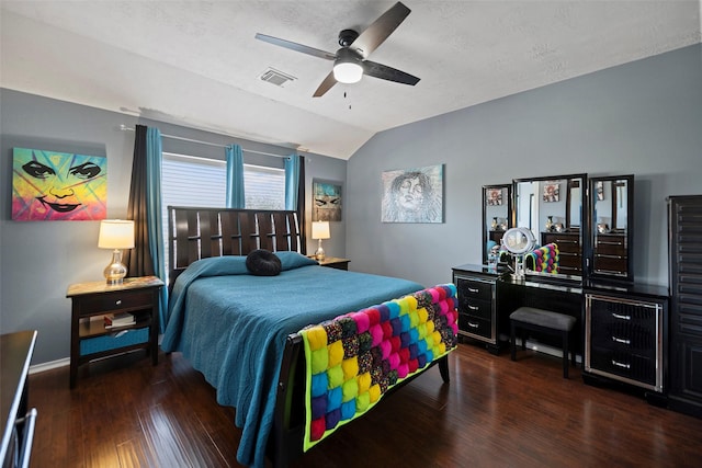 bedroom with lofted ceiling, visible vents, ceiling fan, wood finished floors, and baseboards