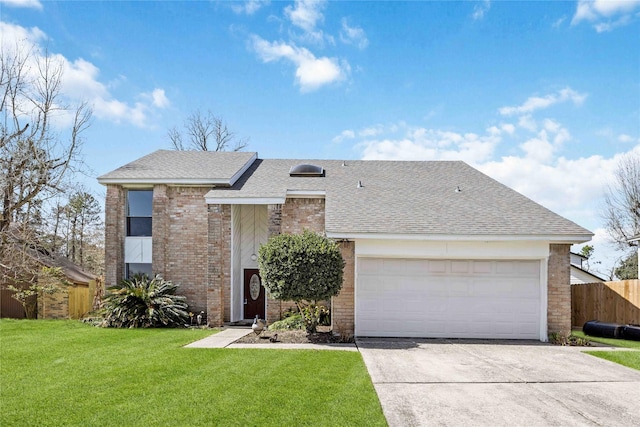 view of front of house featuring brick siding, a shingled roof, a front yard, fence, and a garage