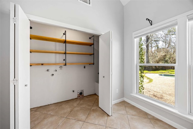 washroom with laundry area, plenty of natural light, hookup for a washing machine, and hookup for an electric dryer