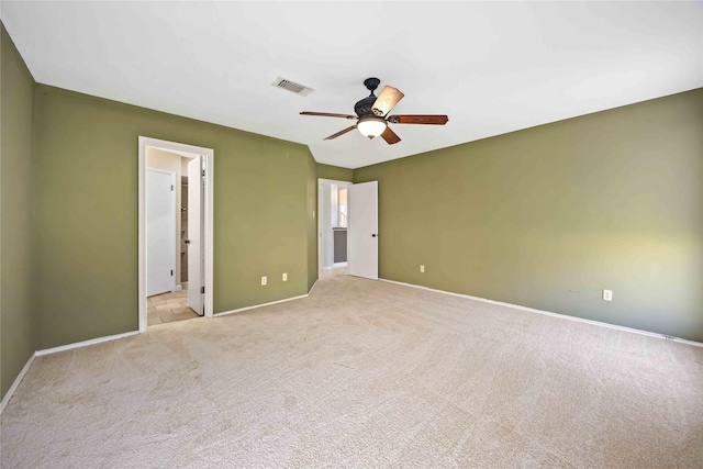 unfurnished bedroom with light carpet, baseboards, visible vents, and a ceiling fan