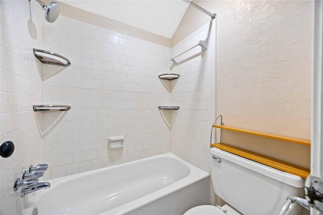 bathroom featuring toilet, shower / tub combination, and a textured wall