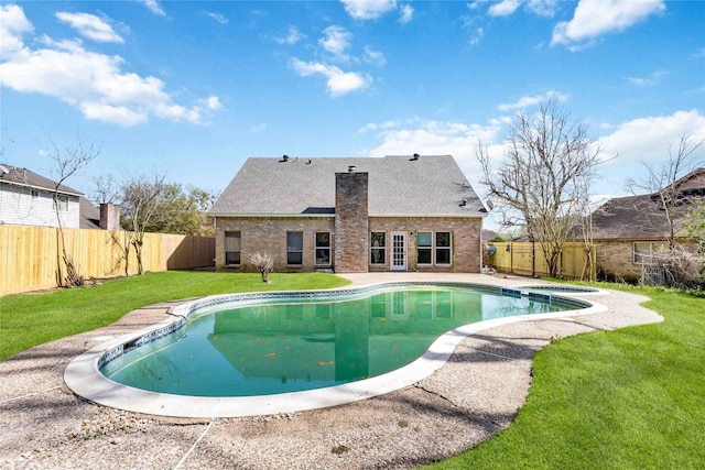 view of pool with a fenced in pool, a patio area, a fenced backyard, and a yard