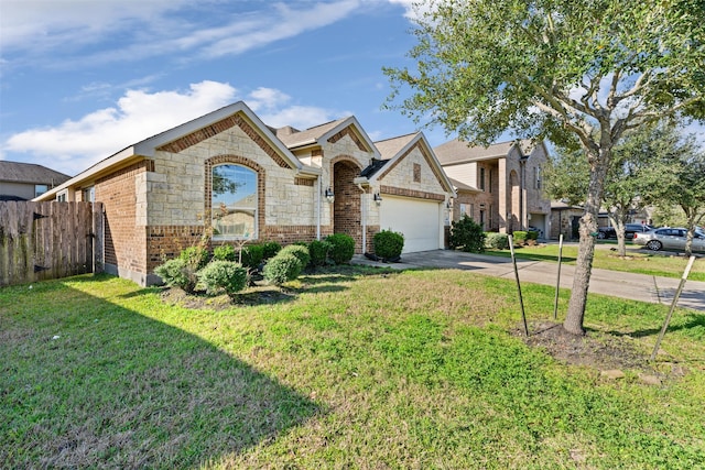 french country home with brick siding, concrete driveway, an attached garage, fence, and a front yard