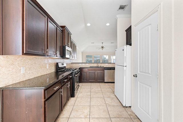 kitchen with dark brown cabinetry, light tile patterned floors, visible vents, appliances with stainless steel finishes, and a sink