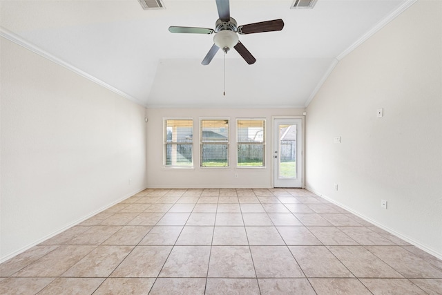 spare room featuring ornamental molding, lofted ceiling, and a wealth of natural light