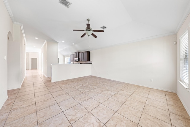 empty room featuring visible vents, crown molding, and ceiling fan