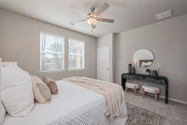 bedroom with visible vents, baseboards, a ceiling fan, and carpet flooring