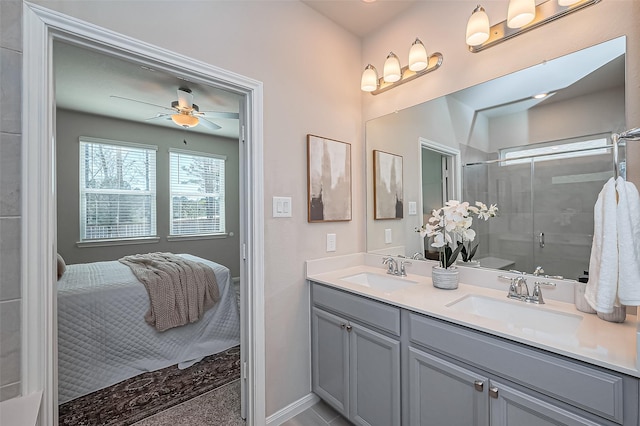 ensuite bathroom with double vanity, an enclosed shower, ensuite bathroom, and a sink