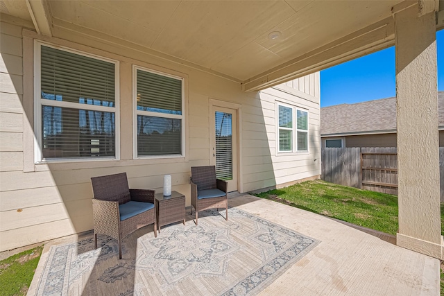 view of patio / terrace featuring fence