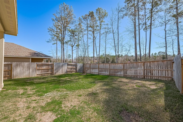 view of yard with a fenced backyard