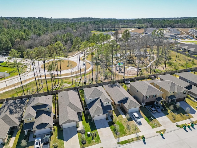 bird's eye view featuring a residential view and a view of trees