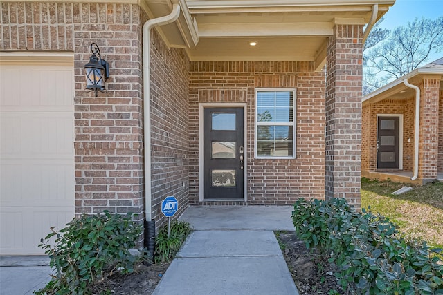 entrance to property with brick siding