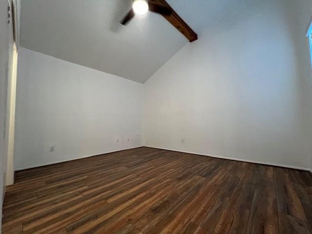 additional living space featuring lofted ceiling with beams, dark wood-style flooring, and a ceiling fan